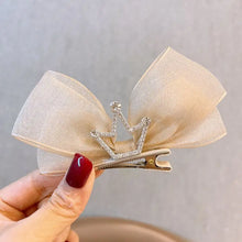 Load image into Gallery viewer, Princess hair clip with bow and crown detail.
